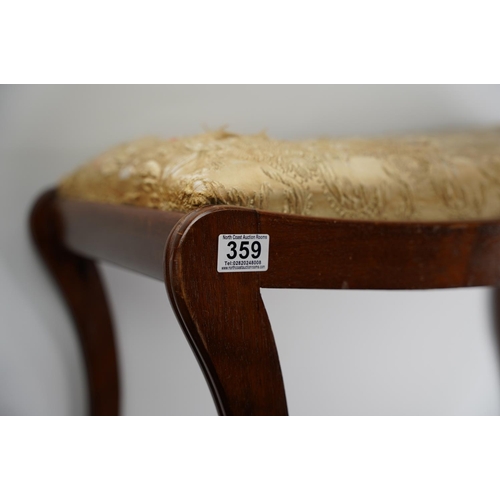 359 - A large mahogany upholstered piano stool.