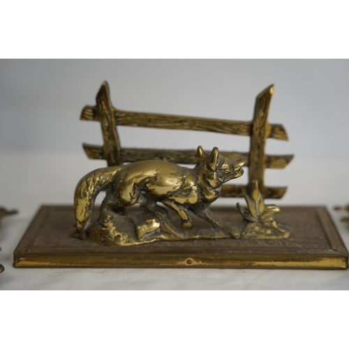 363 - A vintage brass letter rack of a fox and two brass frames.