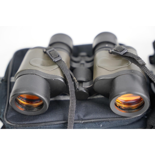 369 - A pair of 8-24x50 zoom field glasses and 7 x 35.