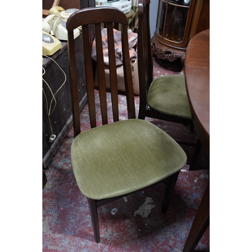 373 - A Mid Century/ vintage extending dining room table and six chair set.