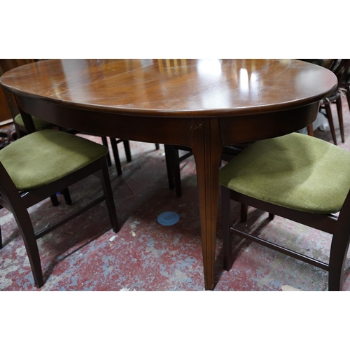 373 - A Mid Century/ vintage extending dining room table and six chair set.