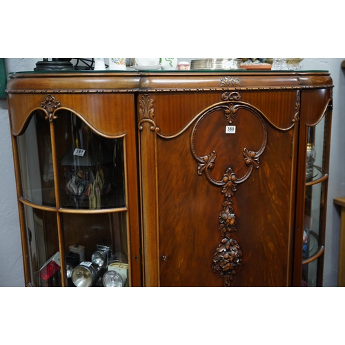 380 - A stunning antique style display cabinet with two curved glass displays either side.