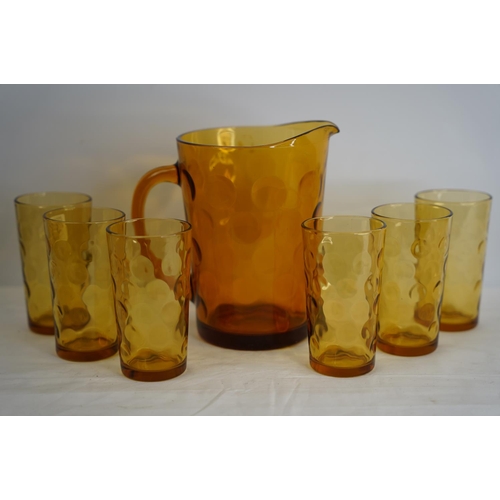 383 - A vintage amber glass drinks set.