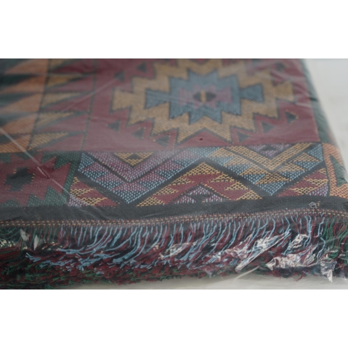 396 - A patterned throw.