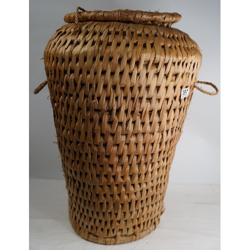 397 - A rattan style linen basket.