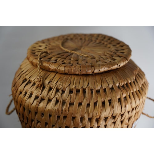 397 - A rattan style linen basket.