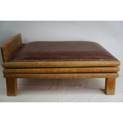 412 - A vintage leather upholstered adjustable footstool.