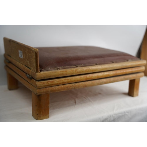 412 - A vintage leather upholstered adjustable footstool.