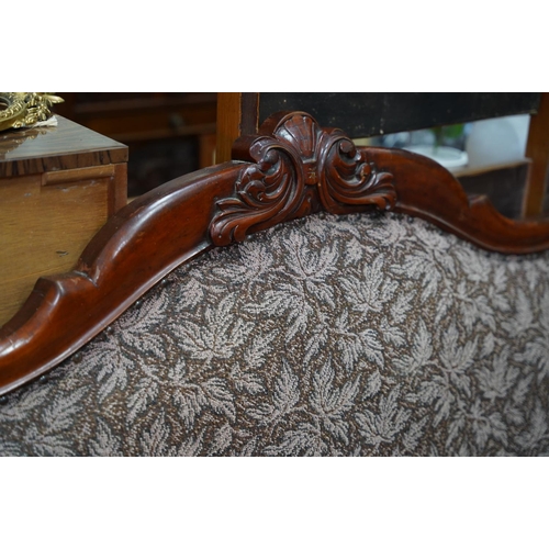 423 - An antique mahogany double end chaise lounge.