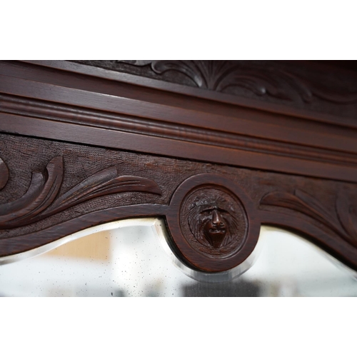 424 - An antique mahogany sideboard/dresser with bevelled glass mirror panels.