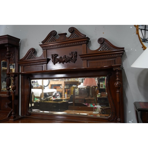 425 - A stunning antique mahogany sideboard with bevelled glass mirror panel and gallery shelf.