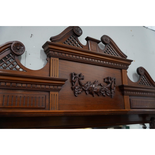 425 - A stunning antique mahogany sideboard with bevelled glass mirror panel and gallery shelf.