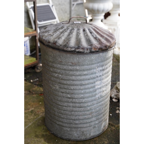 436 - A vintage galvanised dust bin and lid.