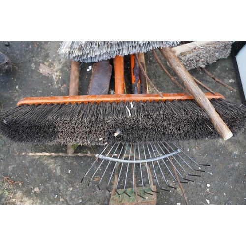 453 - A large yard brush and a lot of assorted gardening tools and more.