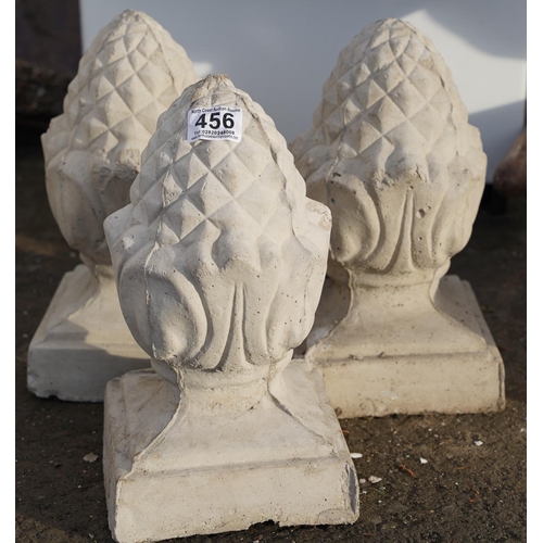 456 - Three concrete acorn pillar toppers.