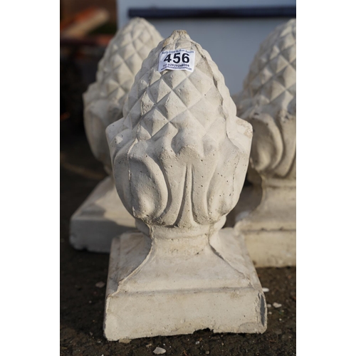 456 - Three concrete acorn pillar toppers.