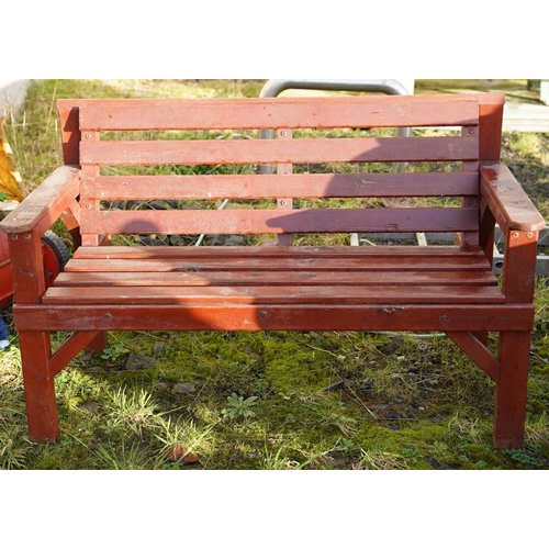 477 - A wooden garden bench.