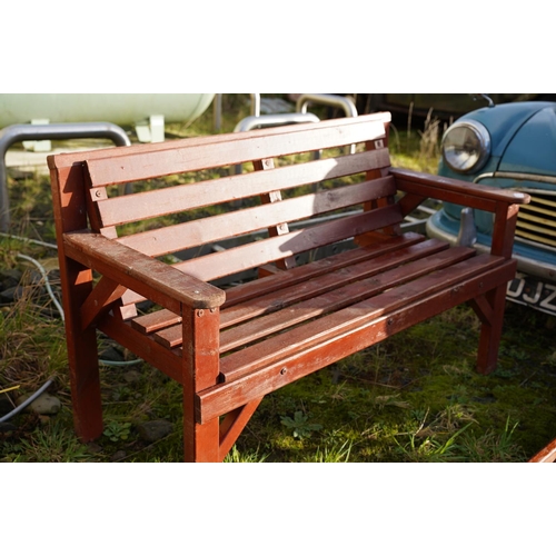 477 - A wooden garden bench.