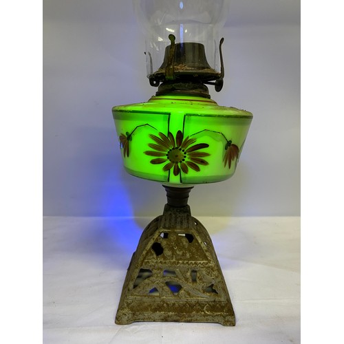 207 - A vintage hand painted Uranium glass cottage style oil lamp.