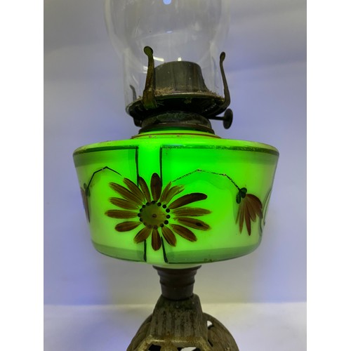 207 - A vintage hand painted Uranium glass cottage style oil lamp.