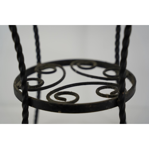 1 - A vintage wrought iron plant stand.