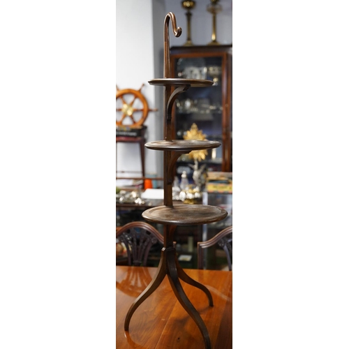 119 - A mahogany three tier cakestand with flat back.