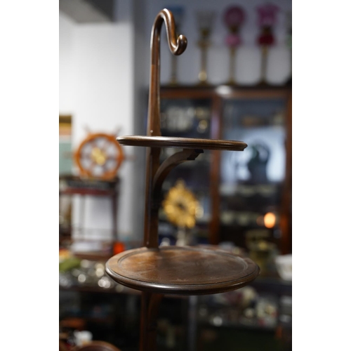 119 - A mahogany three tier cakestand with flat back.