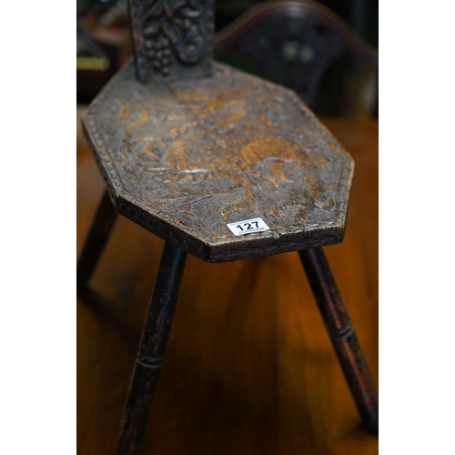 127 - A stunning antique Welsh design spinning chair with hand carved dragon design.