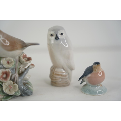 147 - Three Royal Copenhagen bird figures and a Lladro bird figure.