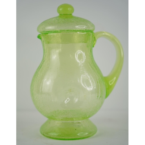 17 - A stunning Uranium glass pitcher and lid.