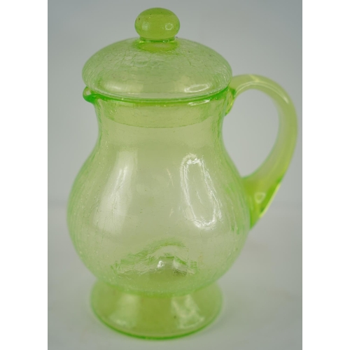 17 - A stunning Uranium glass pitcher and lid.