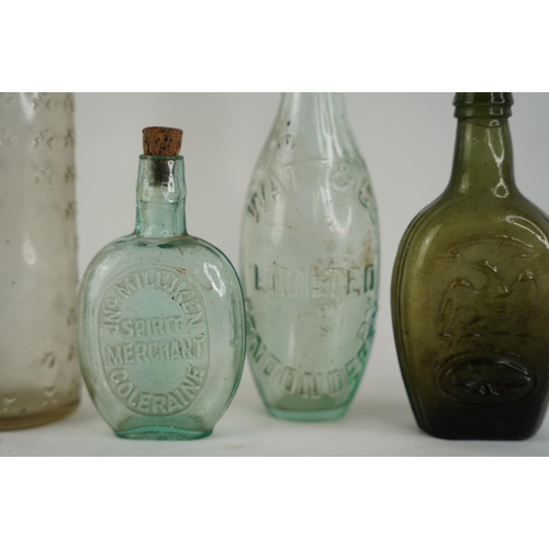 24 - An antique Watt & Co Limited Londonderry glass bottle, a JN Milliken, Coleraine glass bottle and two... 