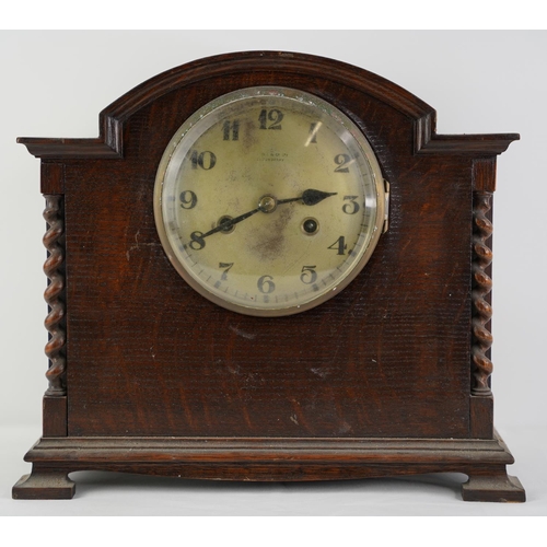 4 - A large vintage oak cased mantle clock.