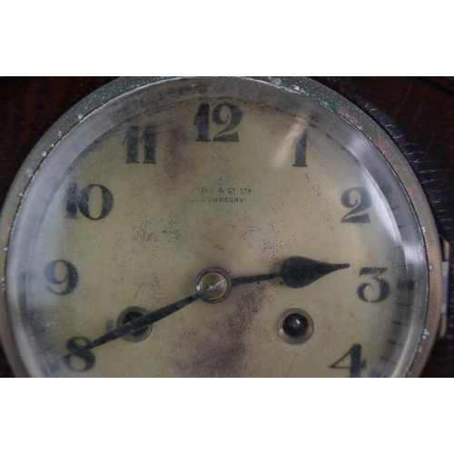 4 - A large vintage oak cased mantle clock.