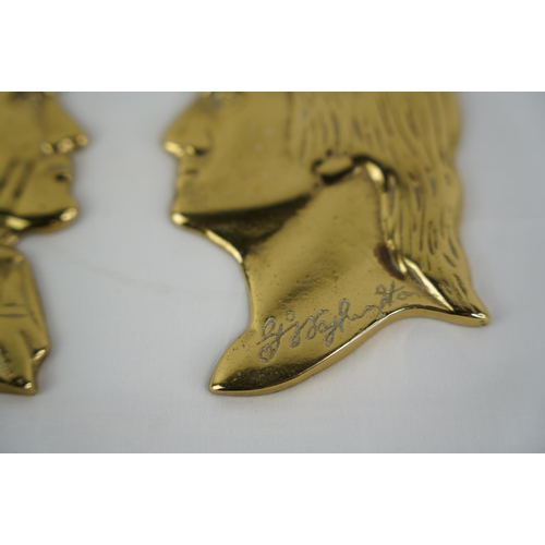 41 - A pair of vintage brass silhouettes of gents.