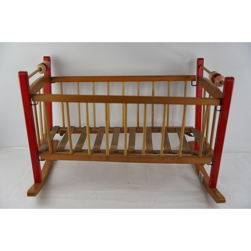 56 - A vintage child's toy cradle.