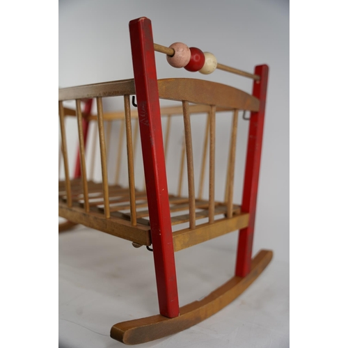 56 - A vintage child's toy cradle.