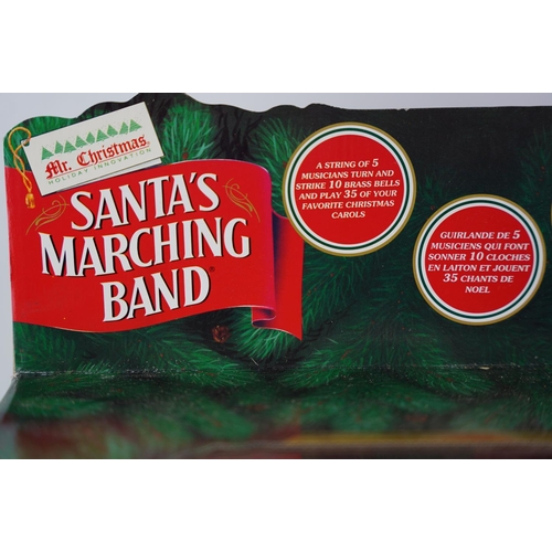 61 - A vintage boxed 'Santa Marching Band'.