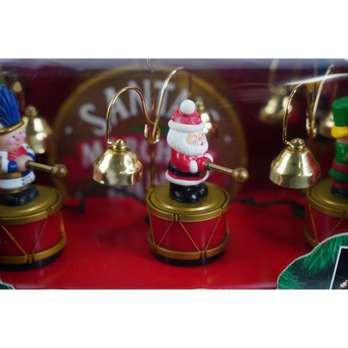 61 - A vintage boxed 'Santa Marching Band'.