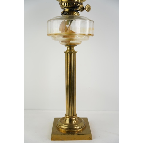 157 - An antique Corinthian clear glass font oil lamp with etched glass shade.