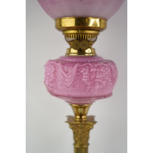 158 - A superb antique Corinthian pink glass font oil lamp with etched pink glass shade.