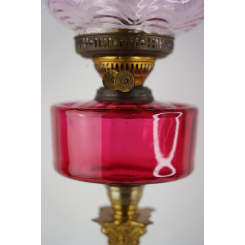 159 - A superb antique Corinthian ruby glass font oil lamp with coloured glass shade.