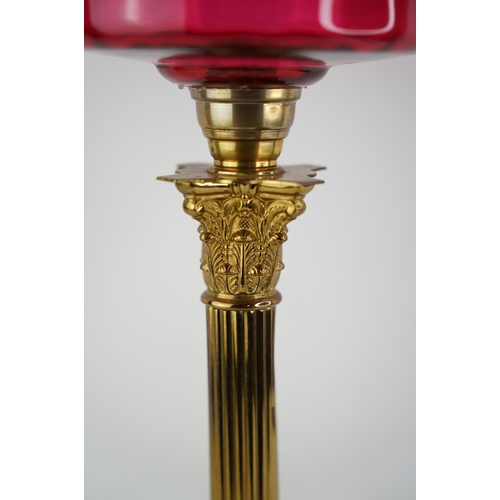 159 - A superb antique Corinthian ruby glass font oil lamp with coloured glass shade.