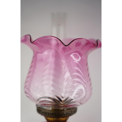 159 - A superb antique Corinthian ruby glass font oil lamp with coloured glass shade.