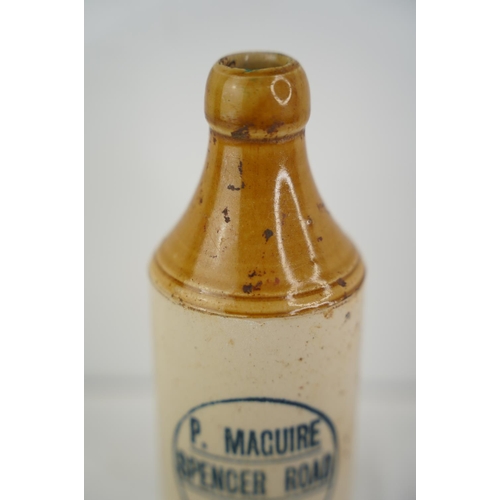 168 - An antique P Maguire, Spencer Road, Derry stoneware beer bottle.