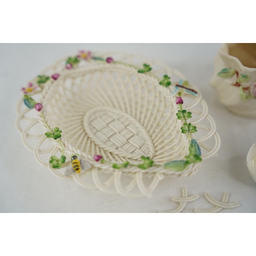 187 - Two Belleek pottery black stamp shell shaped dishes and another and a Belleek pottery four strand fl... 