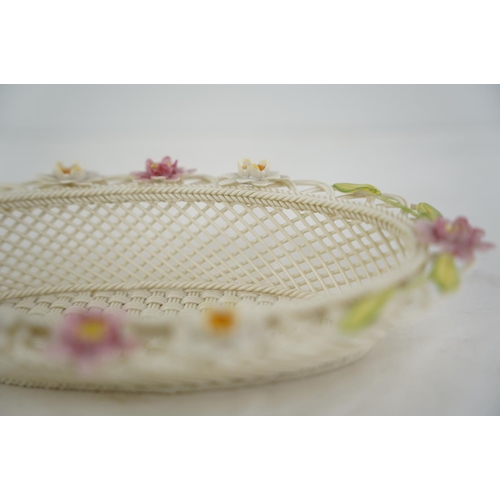 195 - A Belleek pottery limited edition three strand basket 'Lily Blossoms Basket' (a/f).