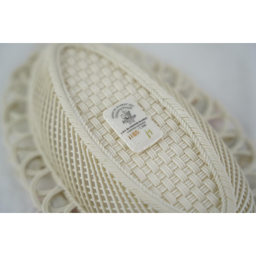 195 - A Belleek pottery limited edition three strand basket 'Lily Blossoms Basket' (a/f).