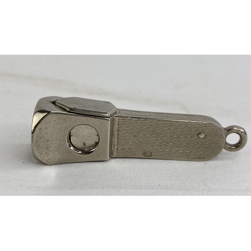 183 - A Sterling silver cigar cutter.