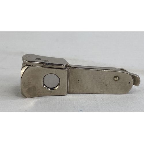 184 - A silver plated cigar cutter.